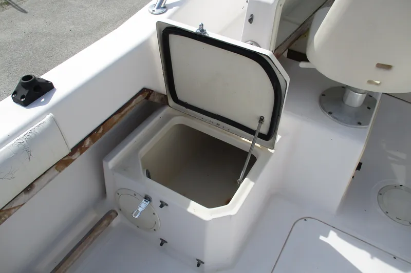 Slide: The Image of Open storage compartment on 1995 Grady-White Adventure 208 boat deck. - 17