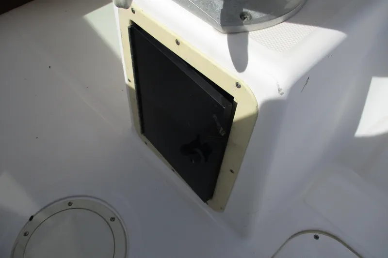Slide: The Image of Grady-White Adventure 208 boat interior detail, featuring a storage compartment, 1995 model. - 24