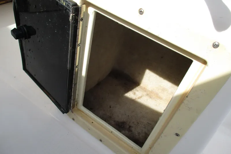Slide: The Image of Open storage compartment on 1995 Grady-White Adventure 208 boat. - 25