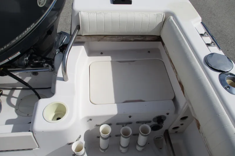 Slide: The Image of 1995 Grady-White Adventure 208 boat interior with seating and storage compartments. - 26
