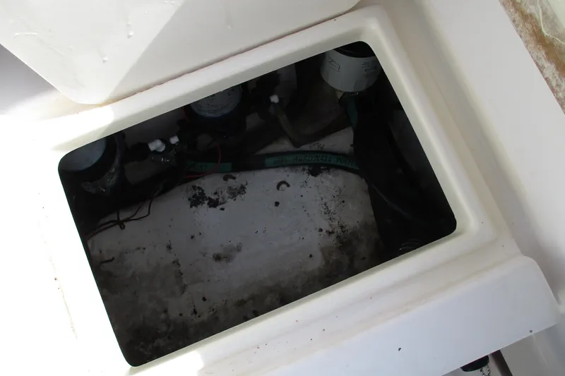 Slide: The Image of Open storage compartment in 1995 Grady-White Adventure 208 boat. - 28