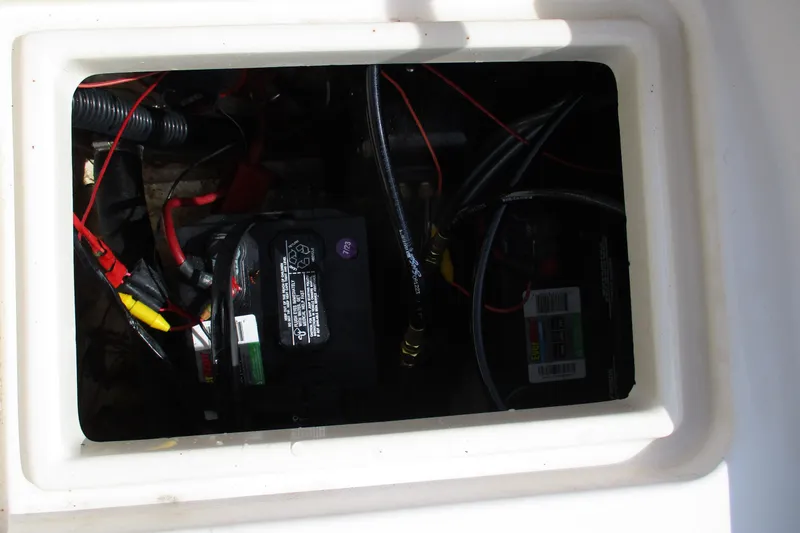 Slide: The Image of Battery compartment of a 1995 Grady-White Adventure 208 boat with wiring visible. - 31