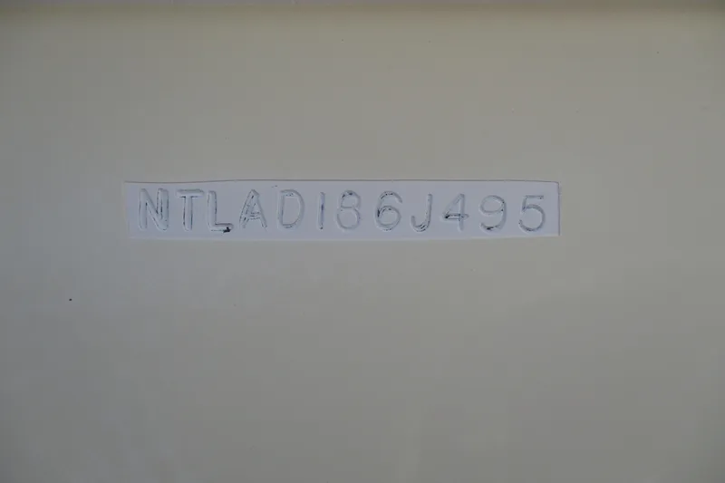 Slide: The Image of Hull identification number on 1995 Grady-White Adventure 208 boat. - 34
