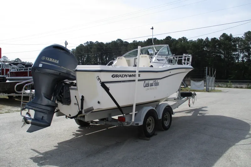 Slide: The Image of 1995 Grady-White Adventure 208 boat on trailer with Yamaha outboard motor. - 7