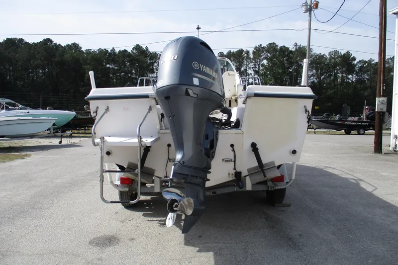 Slide: The Image of 1995 Grady-White Adventure 208 boat with Yamaha outboard motor, parked outdoors. - 8