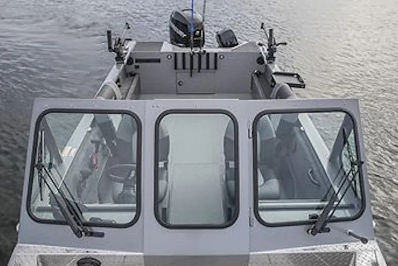 Slide: The Image of 2026 Crestliner 1850 Commander boat on water, featuring spacious cockpit and windshield. - 5