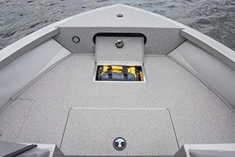 Slide: The Image of 2026 Crestliner 1850 Commander boat interior with storage compartment on water. - 6