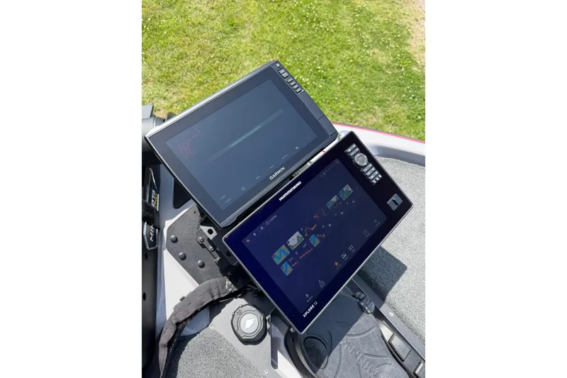 Slide: The Image of Dual marine displays on a 2025 Skeeter ZXR21 boat, featuring Garmin and Humminbird electronics. - 10