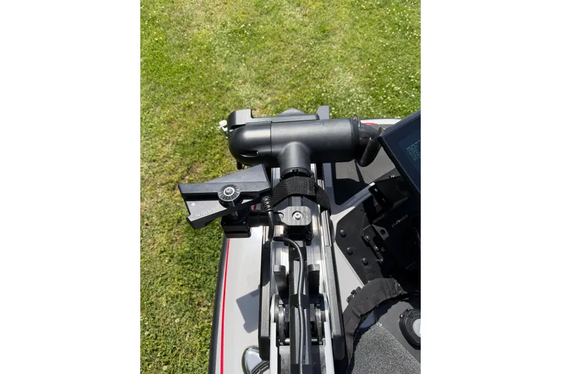 Slide: The Image of Close-up of Skeeter ZXR21 boat equipment, 2025 model, on grassy background. - 11