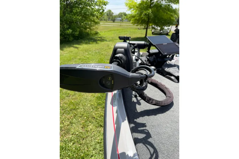 Slide: The Image of 2025 Skeeter ZXR21 boat deck with trolling motor and control panel, outdoors. - 13
