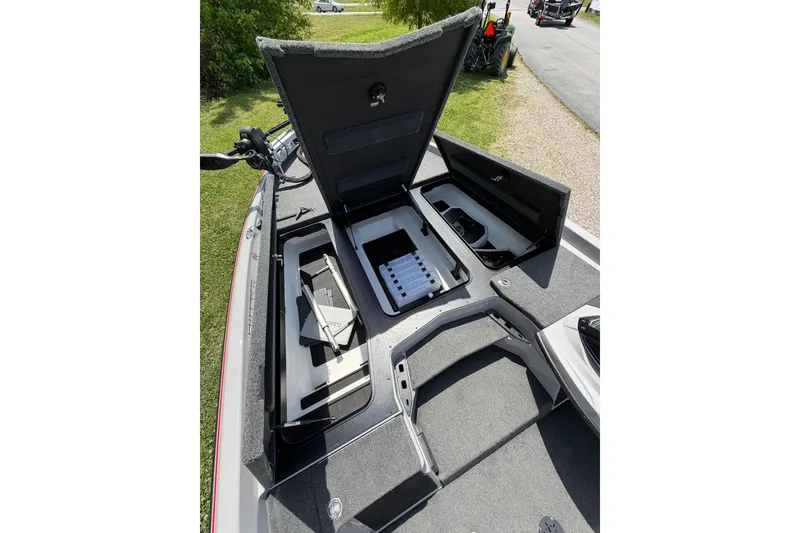 Slide: The Image of 2025 Skeeter ZXR21 boat with open storage compartments and equipment on deck. - 14