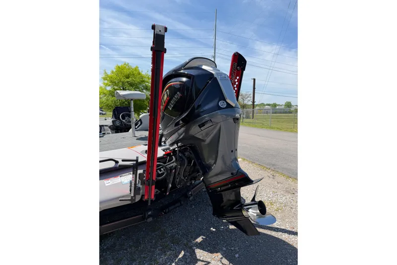 Slide: The Image of 2025 Skeeter ZXR21 boat with Yamaha outboard motor, parked outdoors. - 2