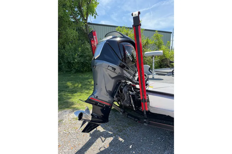 Slide: The Image of 2025 Skeeter ZXR21 boat with Yamaha outboard motor, parked outdoors. - 3