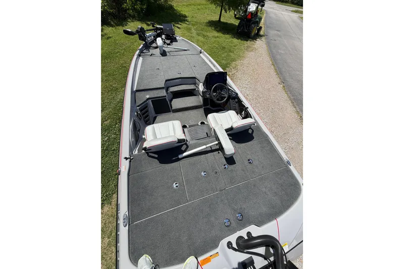 Slide: The Image of 2025 Skeeter ZXR21 fishing boat with dual seats and advanced navigation equipment. - 5