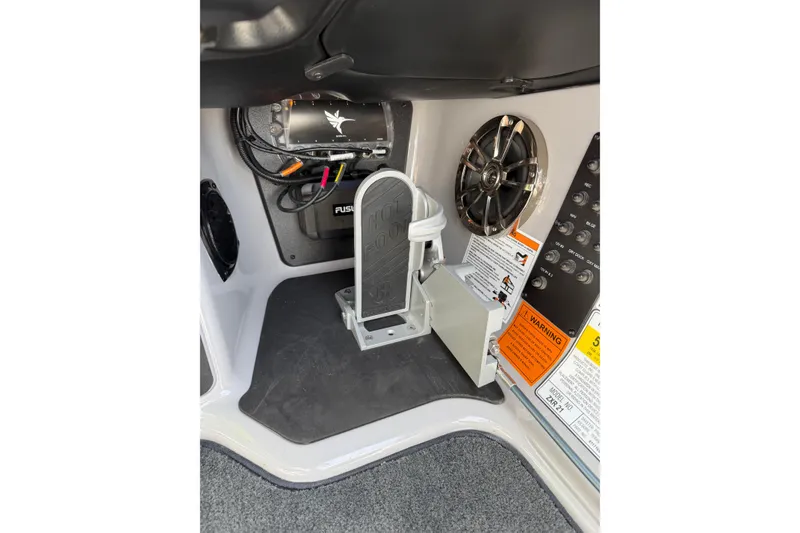 Slide: The Image of 2025 Skeeter ZXR21 boat interior with foot pedal, speaker, and control panel. - 9