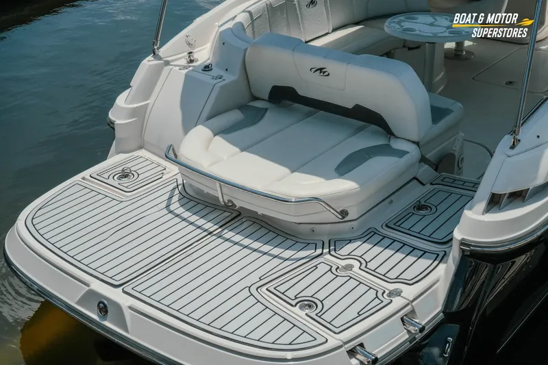 Slide: The Image of 2012 Monterey 264FS boat with spacious seating and sleek deck design on the water. - 11