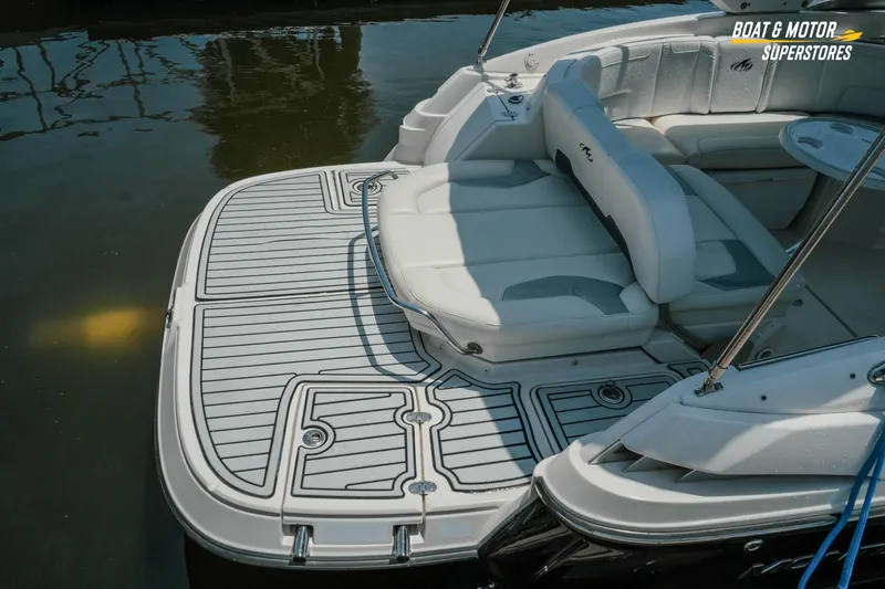 Slide: The Image of 2012 Monterey 264FS boat with spacious seating and sleek deck design. - 13