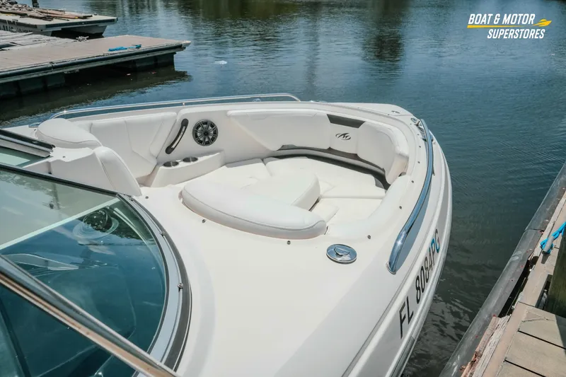 Slide: The Image of 2012 Monterey 264FS boat docked, featuring spacious seating and sleek design. - 21