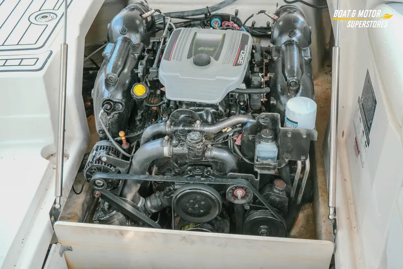 Slide: The Image of Engine compartment of a 2012 Monterey 264FS boat, featuring a 350 MAG engine. - 24