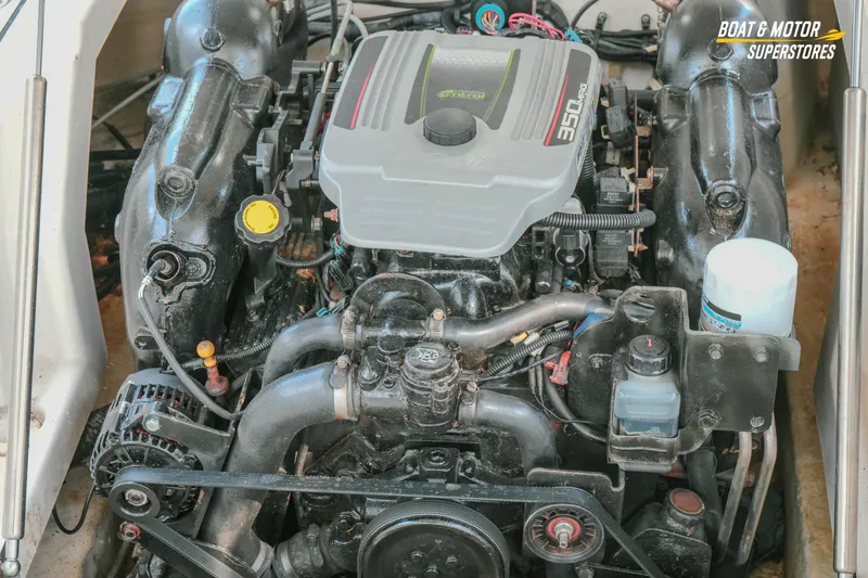 Slide: The Image of Engine of a 2012 Monterey 264FS boat, featuring a 350 MAG motor. - 25