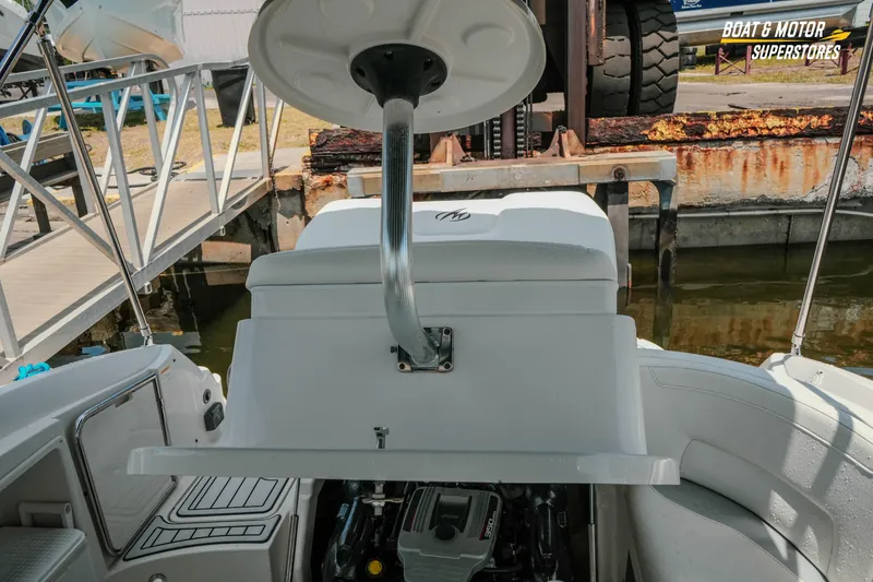 Slide: The Image of 2012 Monterey 264FS boat engine compartment open at dockside. - 27