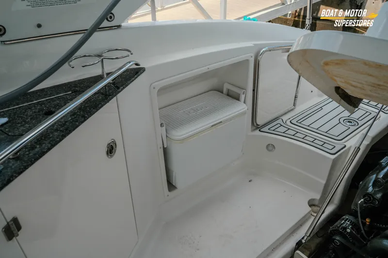 Slide: The Image of Interior of 2012 Monterey 264FS boat with storage compartment and cooler. - 28