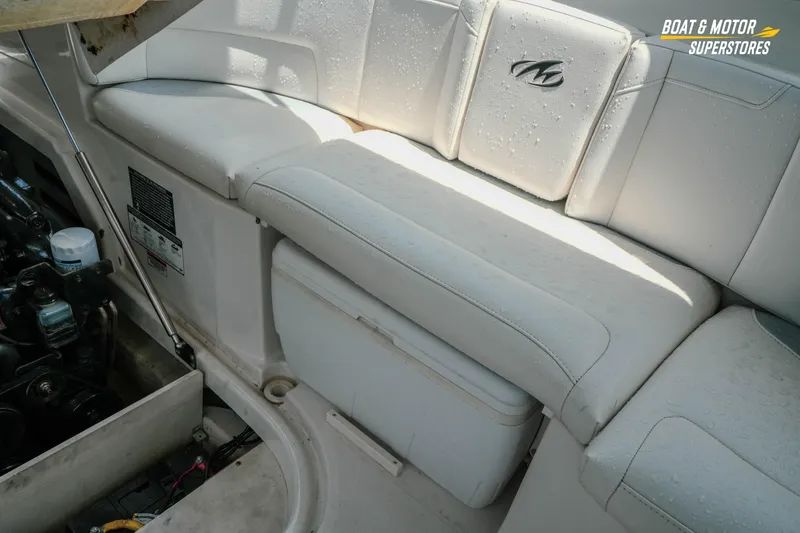 Slide: The Image of Interior of 2012 Monterey 264FS boat with cushioned seating and engine compartment. - 29