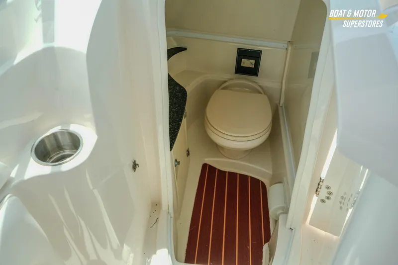 Slide: The Image of Interior view of a 2012 Monterey 264FS boat bathroom with toilet and sink. - 39