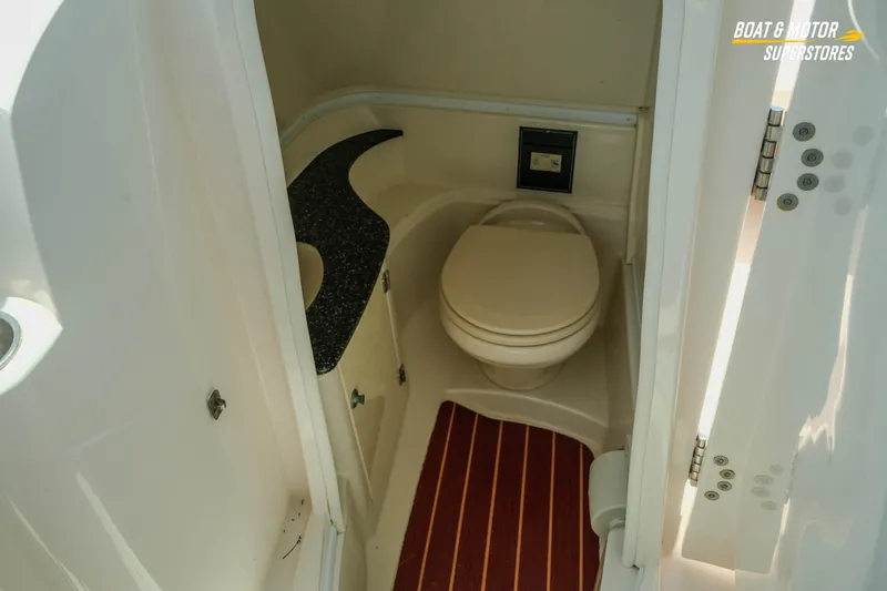 Slide: The Image of 2012 Monterey 264FS boat bathroom with compact toilet and sleek countertop design. - 40