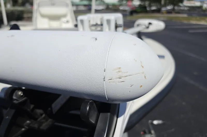 Slide: The Image of Close-up of a 2023 Mako 18 LTS boat detail with visible scratches. - 10