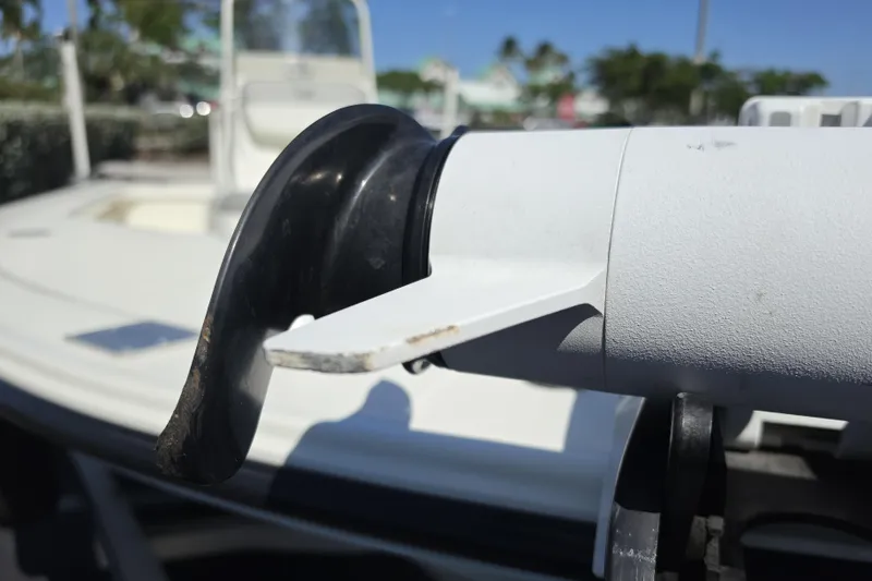 Slide: The Image of Close-up of a 2023 Mako 18 LTS boat detail, showcasing a motor component. - 11