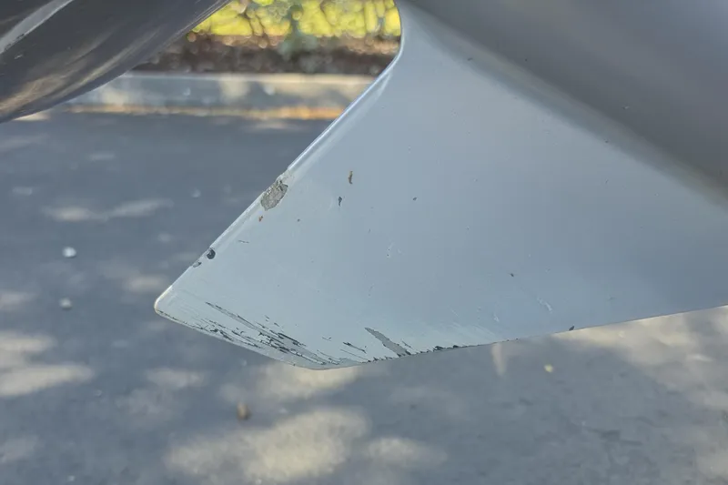 Slide: The Image of Close-up of a 2023 Mako 18 LTS boat propeller with visible wear and scratches. - 15