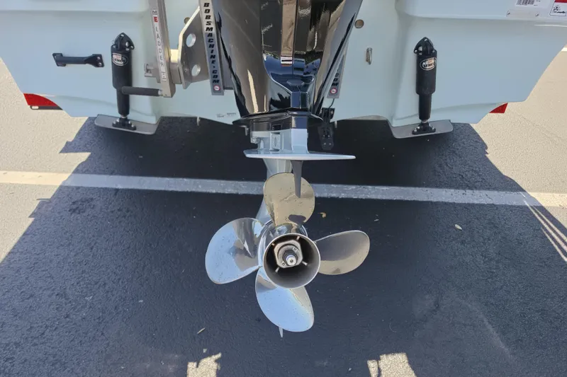 Slide: The Image of 2023 Mako 18 LTS boat propeller and motor detail in parking lot. - 17