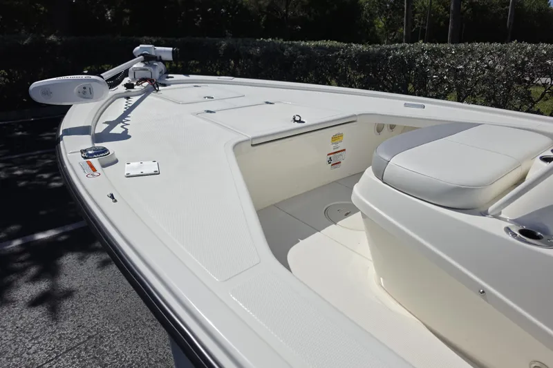 Slide: The Image of 2023 Mako 18 LTS boat interior with seating and trolling motor. - 4