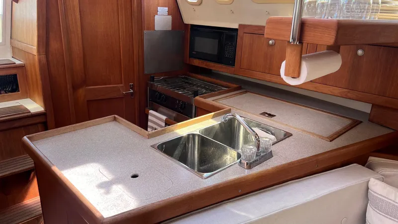 Slide: The Image of Galley area of a 2001 Hunter 340 yacht with sink and stove. - 13