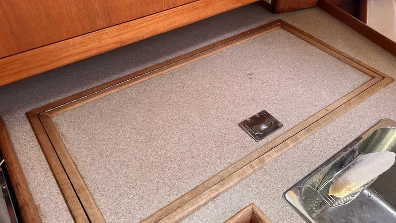Slide: The Image of Interior of a 2001 Hunter 340 yacht with wood and metal accents. - 16