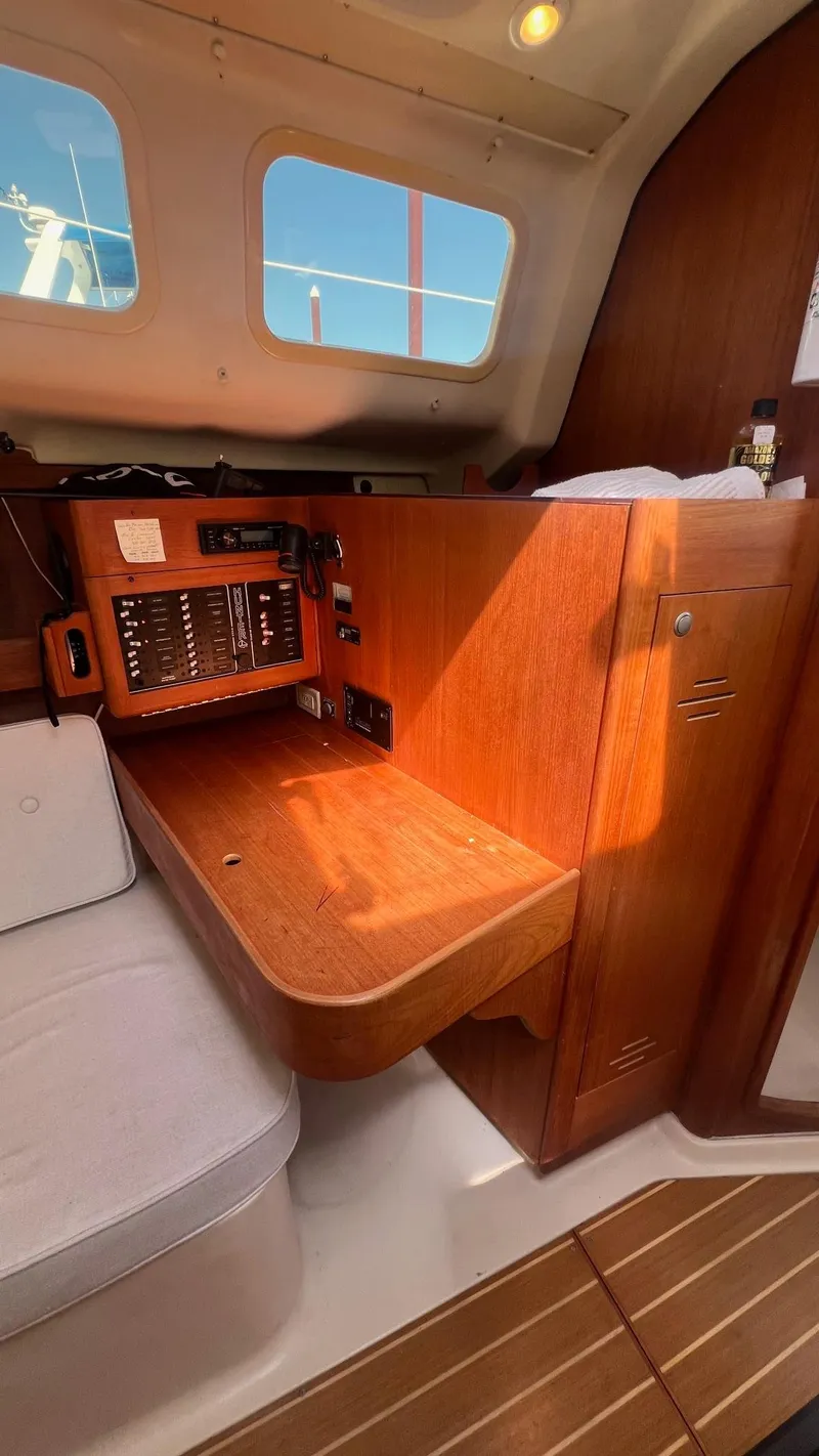 Slide: The Image of Interior of a 2001 Hunter 340 yacht with wooden furnishings. - 18