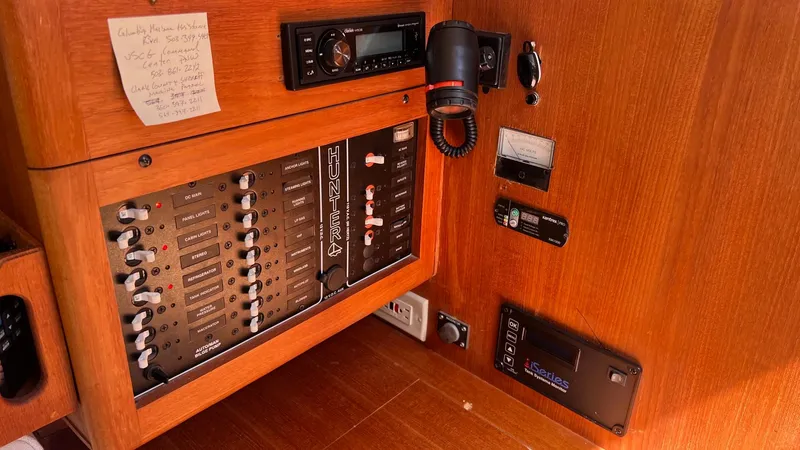 Slide: The Image of Interior view of a 2001 Hunter 340 sailboat with control panel and electronics. - 19