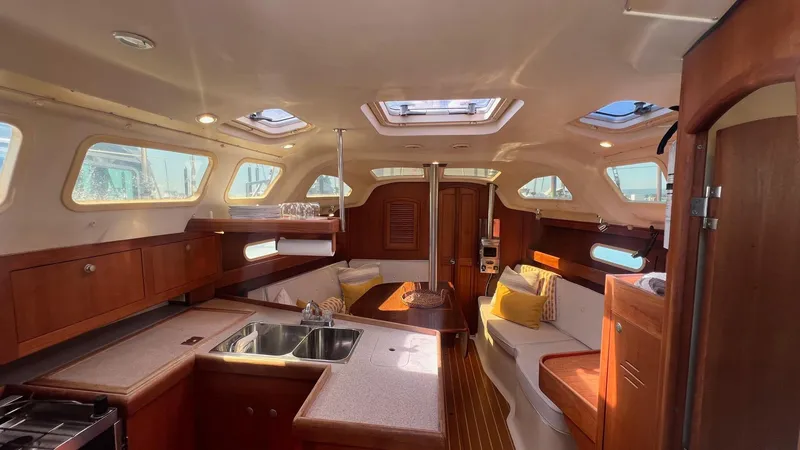 Slide: The Image of Interior of a 2001 Hunter 340 yacht with wooden furnishings. - 2