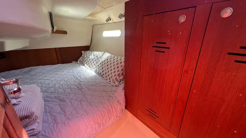Slide: The Image of Interior of a 2001 Hunter 340 yacht with cozy sleeping area. - 21