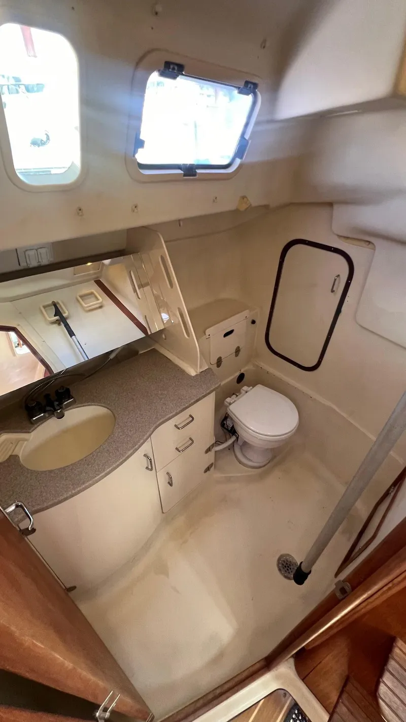 Slide: The Image of Interior of a 2001 Hunter 340 yacht featuring a bathroom. - 23