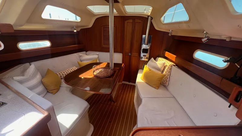 Slide: The Image of Interior of a 2001 Hunter 340 yacht with cozy seating area. - 3