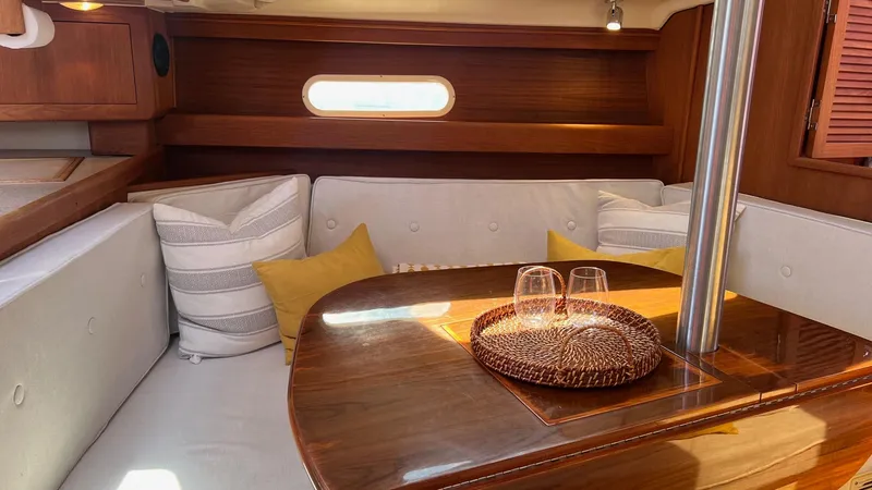 Slide: The Image of Interior of a 2001 Hunter 340 yacht with cozy seating area. - 6