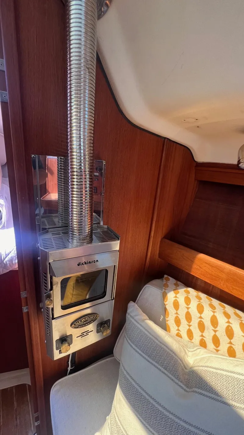 Slide: The Image of Interior of a 2001 Hunter 340 with wood paneling and stove. - 8
