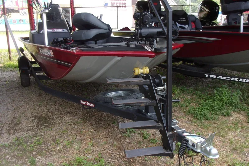 The Image of 2024 Tracker Bass Tracker Classic XL boat on trailer, parked outdoors. - 0
