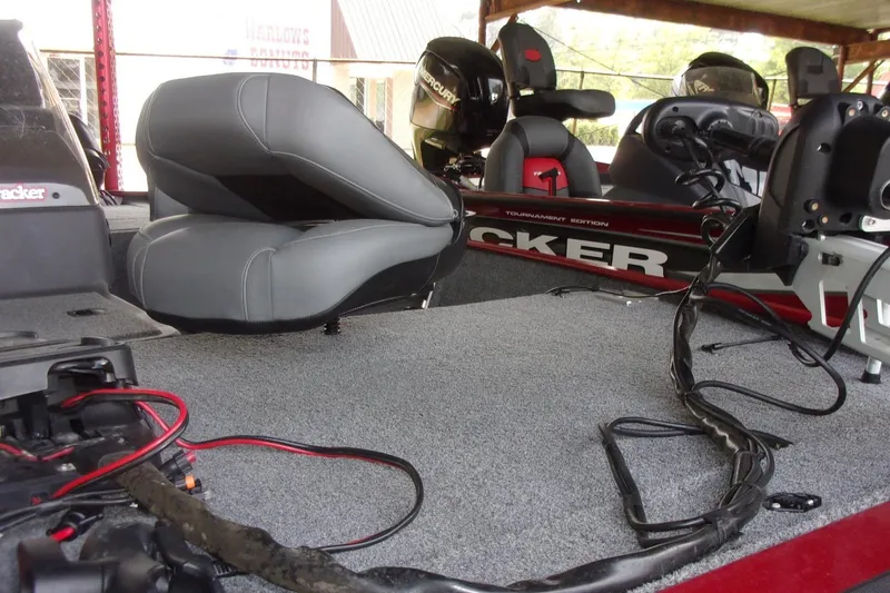 Slide: The Image of 2024 Tracker Bass Tracker Classic XL boat interior with seating and equipment. - 13