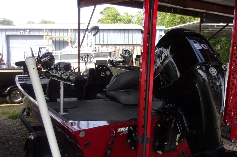 Slide: The Image of 2024 Tracker Bass Tracker Classic XL boat with Mercury engine in storage. - 6