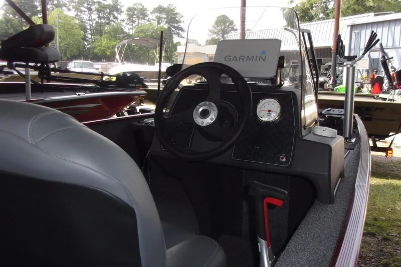 Slide: The Image of 2024 Tracker Bass Tracker Classic XL boat interior with Garmin navigation system. - 9