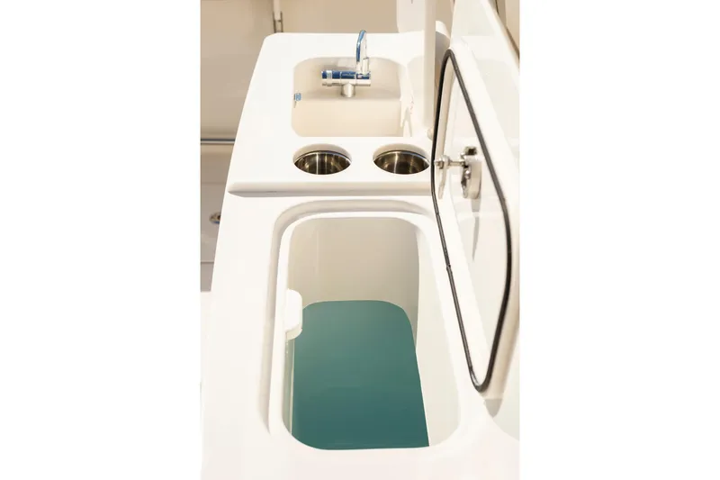 Slide: The Image of Sailfish 312 CC 2026 boat interior with sink and storage compartment. - 14