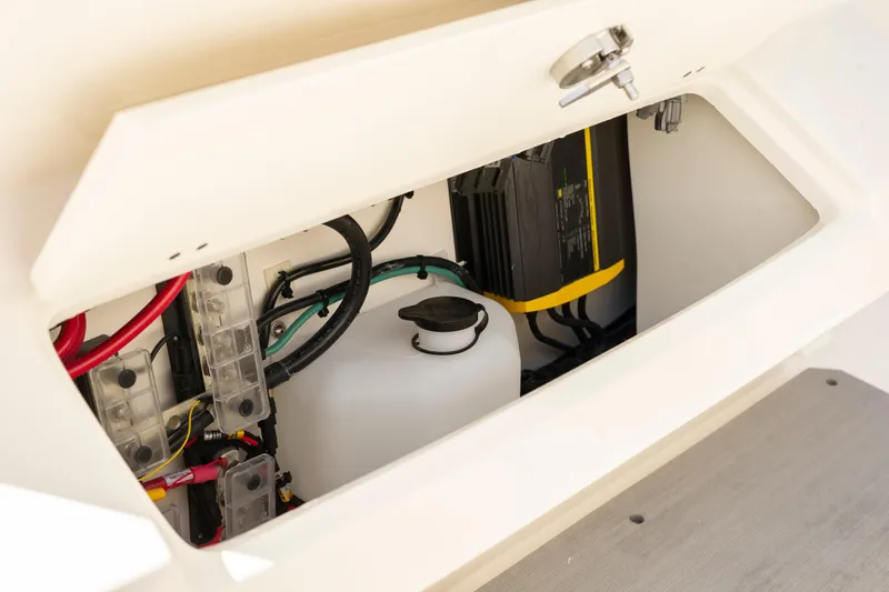 Slide: The Image of 2026 Sailfish 312 CC boat compartment with wiring and equipment. - 17